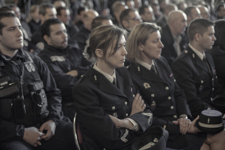 Several police officers in the Marseille's Prefecture listen the speech of the Prime Minister Manuel Valls who provide medals of honor to several officers to thank their struggle and commitment against crime in the city.
Marseille, department of Bouches-du-Rhône and region of Provence-Alpes-Cote d'Azur, France on December 28, 2013.
Marseille is a city with enormous potential, it opens out onto the Mediterranean and it has the character of a cosmopolitan city with a young, multicultural population. This potential and the desire of the ruling class to give the city a new image, earned it the title of European Capital of Culture. The message emitted by the political organizations was clear. The year 2014 is crucial for Marseille. This is its opportunity to rid itself of the stigma of violence and crime that has hung over it, to move on from the social violence that pervades its streets and the obvious economic inequality.
Under the label of Cultural Capital, earned after a financial investment of over 600 million euros, Marseille has experienced a huge urban transformation, with the main focus being the rehabilitation of the most emblematic areas and the creation of new cultural facilities in the old port.
Today, with the cranes gone and the construction finished, the inhabitants of Marseille wake up with a bittersweet sensation, aware of how, despite initial promises, financial resources have been used to beautify chosen areas and collectives, leaving the disadvantaged neighborhoods totally excluded and accentuating the economic and socio-cultural contrasts.